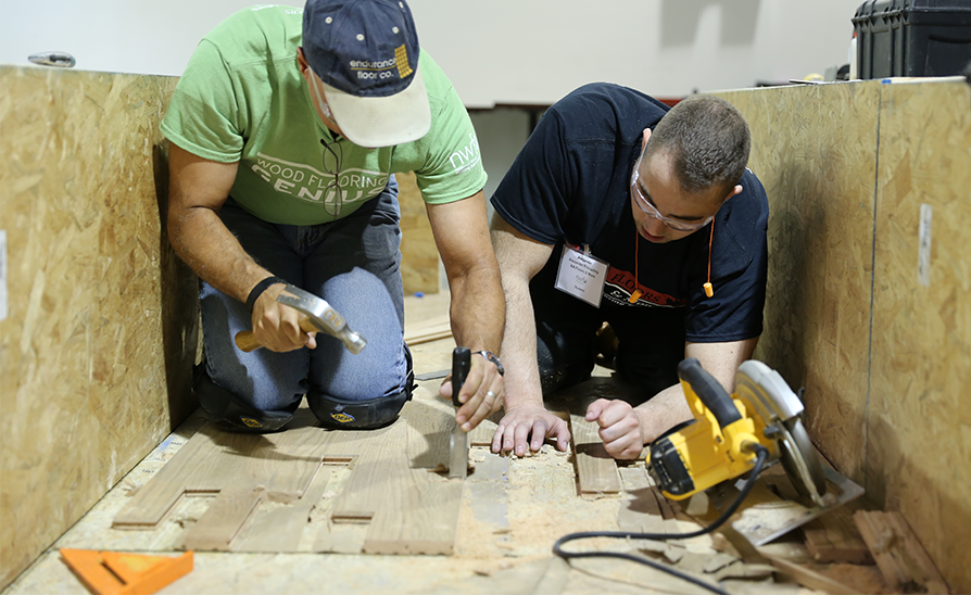 men learning to install wood flooring from a NWFA member