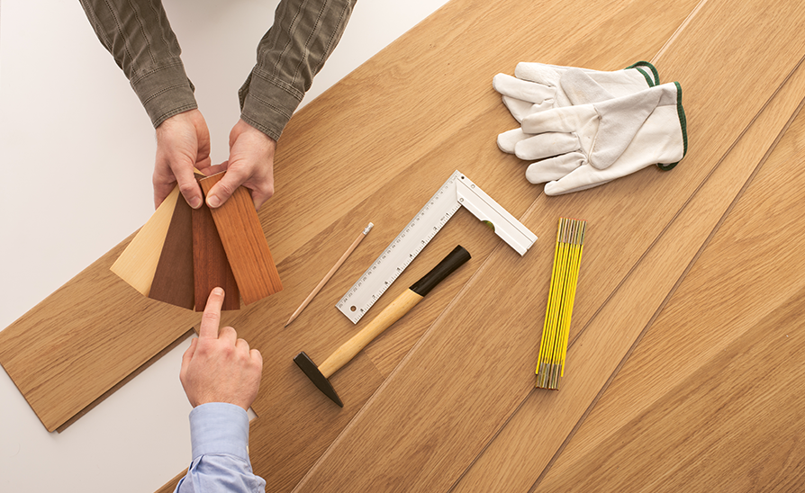 person involved in the wood flooring buying process selecting wood finishes
